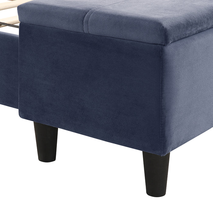 Right facing close up of the storage bench on a contemporary grey upholstered full bed with attached storage bench in a room with linens and accessories