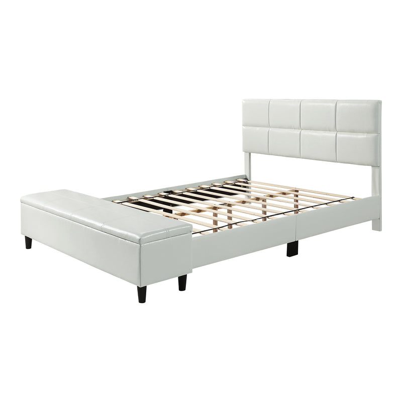 Left facing contemporary white upholstered full bed with attached storage bench on a white background