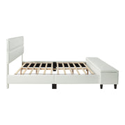 Front facing side view of a contemporary white upholstered full bed with attached storage bench on a white background