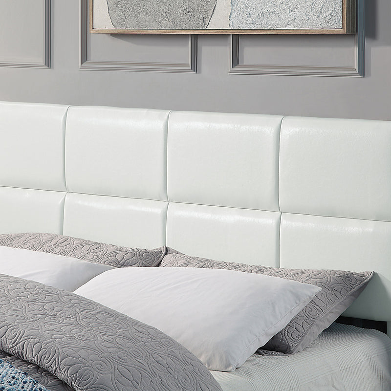 Left facing close up of the headboard on a contemporary white upholstered full bed with attached storage bench on a white background