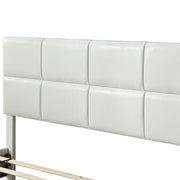 Left facing close up of the headboard on a contemporary white upholstered full bed with attached storage bench on a white background
