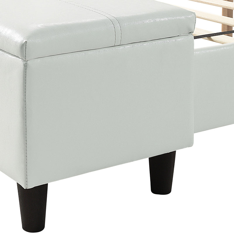 Left facing close up of the storage bench on a contemporary white upholstered full bed with attached storage bench in a room with linens and accessories