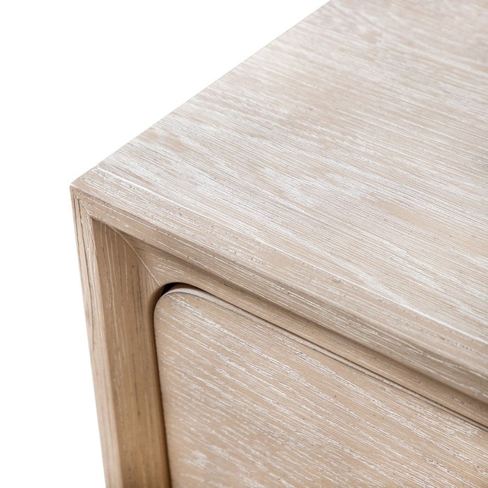 Left facing rounded corner drawer design on a transitional light oak two-drawer nightstand with a metal base, on a white background