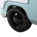 Angled close up of the wheel on a vintage teal peace bus novelty kid's platform bed