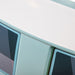 Left facing close up of a vintage teal peace bus novelty kid's platform bed