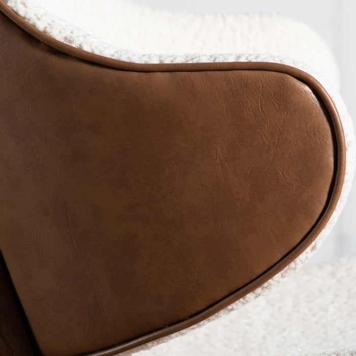 Front facing close up of the faux leather outer of a mid-century modern walnut and ivory boucle accent armchair in a room