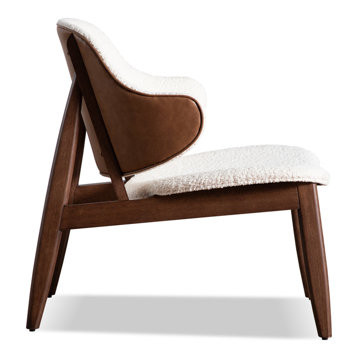 Front facing side view of a mid-century modern walnut and ivory boucle accent armchair on a white background
