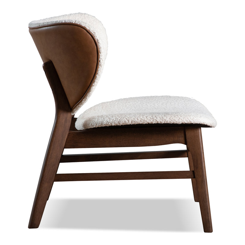 Front facing side view of a mid-century modern walnut and ivory boucle wingback accent chair on a white background