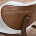 Informational image of the faux leather on a mid-century modern walnut and ivory boucle wingback accent chair