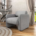 Left facing contemporary gray boucle upholstered accent armchair in a room with accessories