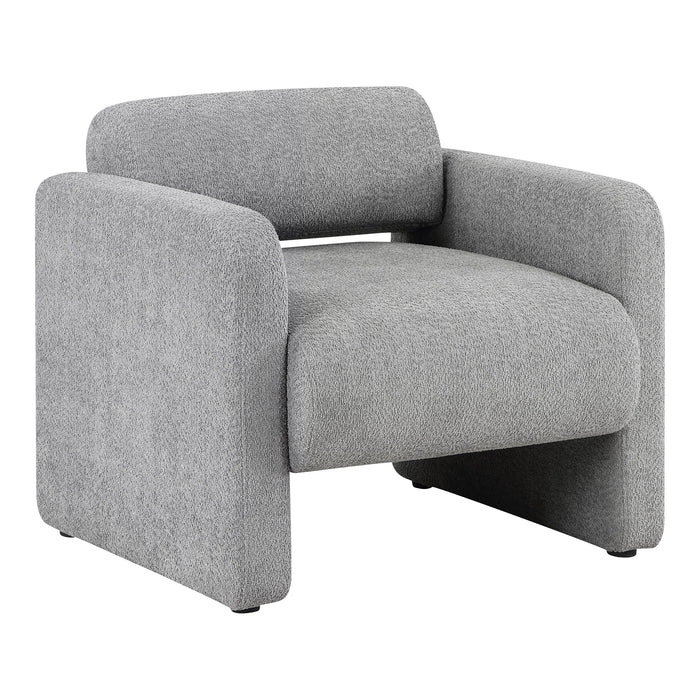 Right facing contemporary gray boucle upholstered accent armchair on a white background
