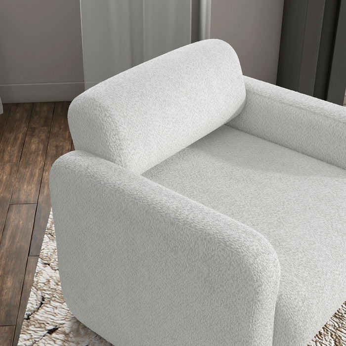 Right facing bird's eye view of a contemporary white boucle upholstered accent armchair in a room