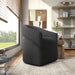 Right facing contemporary charcoal grey boucle 360-degree swivel accent chair in a room with accessories