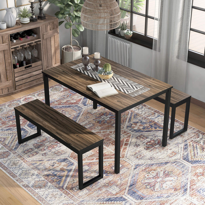 Right angled rustic walnut and black three-piece dining table and benches set in a dining room with accessories