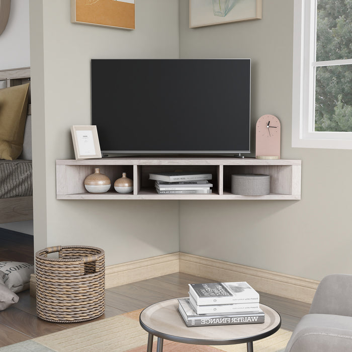Front facing contemporary white oak floating wall mount media console in a room with accessories
