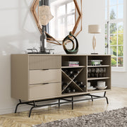 Right facing contemporary three-drawer light taupe and black buffet with a wine rack in a room with accessories