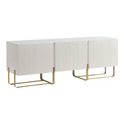 Right facing contemporary white and vintage gold fluted three-door TV stand on a white background