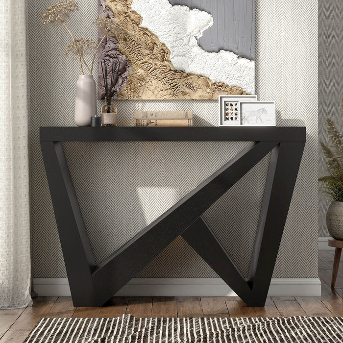 Front facing modern farmhouse black slant-design console table in a room with accessories
