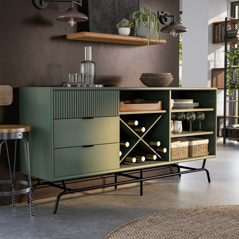 Right facing contemporary three-drawer sage green and black TV stand with a wine rack in a room with accessories