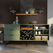 Front facing contemporary three-drawer sage green and black TV stand with a wine rack in a room with accessories