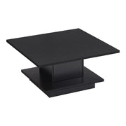 Right facing modern black square storage coffee table on a white background