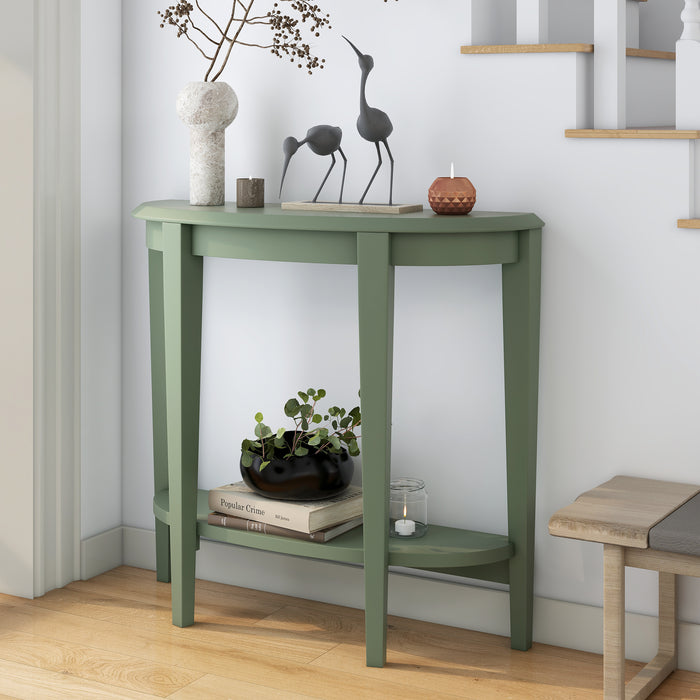 Left facing modern sage green demi-lune one-shelf console table in a room with accessories