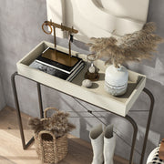 Left facing bird's eye view of a modern cream weave and black tray style console table in a room with accessories