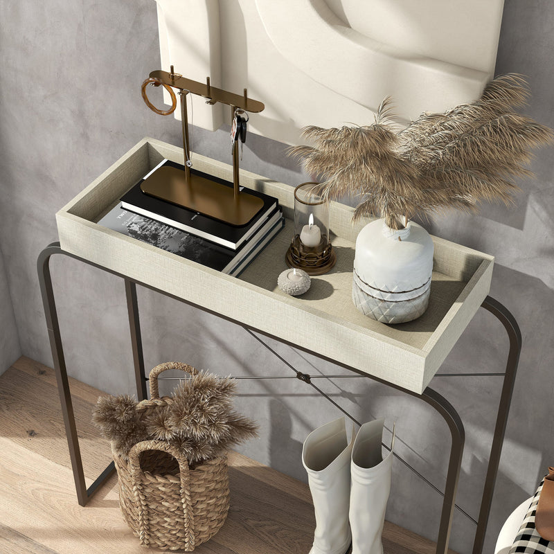 Left facing bird's eye view of a modern cream weave and black tray style console table in a room with accessories