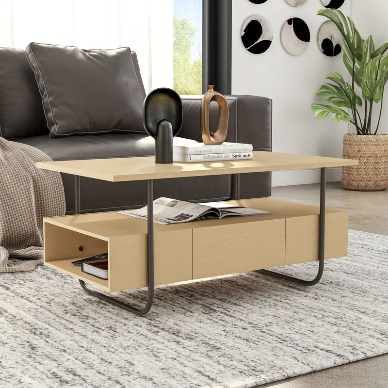 Right facing contemporary light maple and black multi-shelf coffee table with one drawer in a living room with accessories