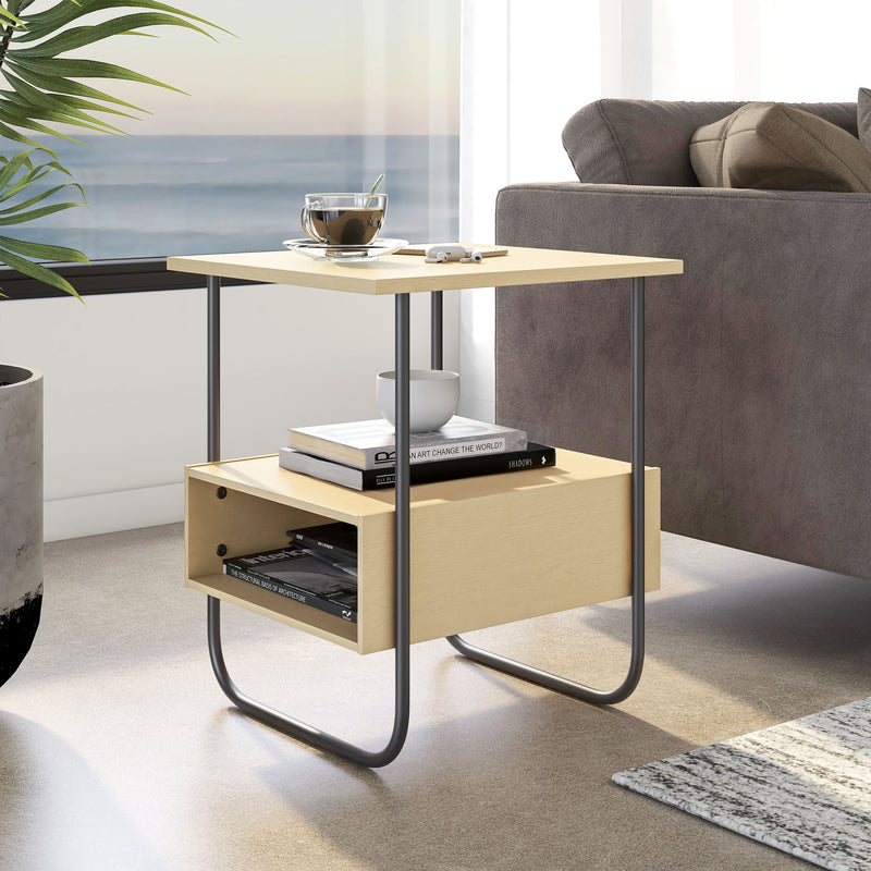 Right facing contemporary light maple and black two-shelf end table in a room with accessories