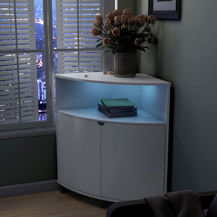 Left facing contemporary pure white two-door corner cabinet with LED lighting in a room with accessories