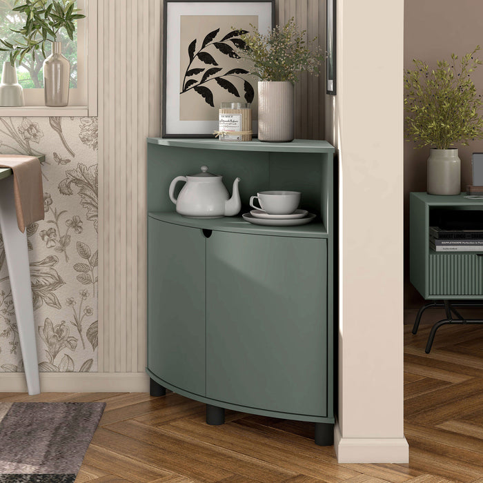 Left facing contemporary sage green two-door corner cabinet with LED lighting in a room with accessories
