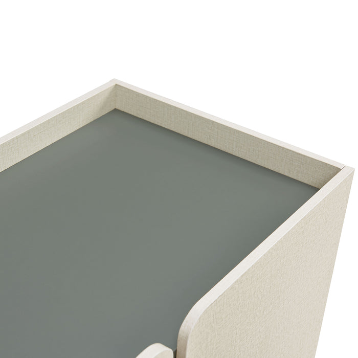 Right facing close up view of the top of a contemporary cream weave and sage green four-door dining buffet on a white background