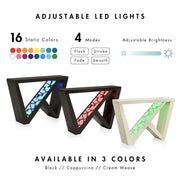 Informational image showing the adjustable LED light colors of a contemporary black W-shaped console table with LED accent lighting and a bird pattern