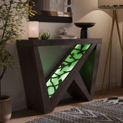 Right facing contemporary red cocoa W-shaped console table with LED accent lighting and a bird pattern in a room with accessories