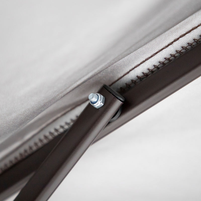 Close up of the support structure of a transitional burgundy outdoor pop-up canopy with one shade wall