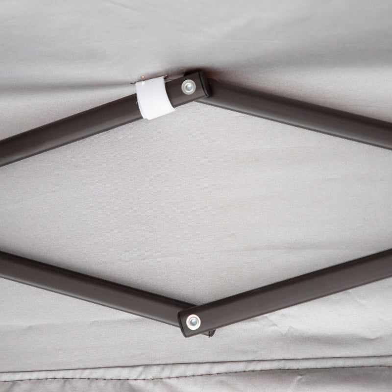 Close up of the support structure of a transitional burgundy outdoor pop-up canopy with one shade wall