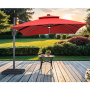 Front facing contemporary red double-top square cantilever umbrella with umbrella on a patio with accessories