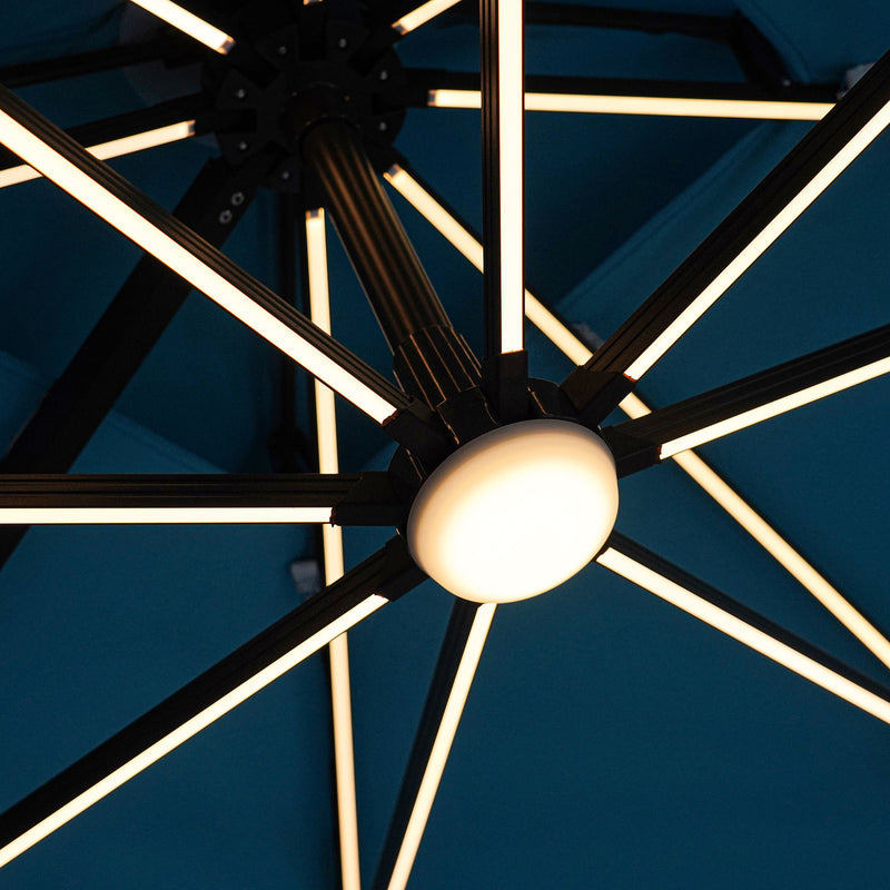 Close up of the lighted support structure of a contemporary teal blue double-top square cantilever umbrella with umbrella