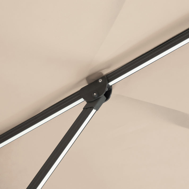 Close up of the support structure on a contemporary cantilever umbrella in tan fabric with solar LED lighting and carrying case