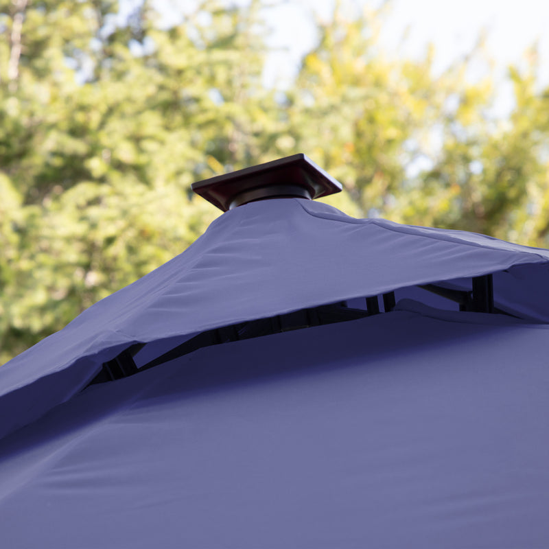 Close up of the vented double roof on a contemporary umbrella in navy blue fabric with solar LED lighting (base not included)