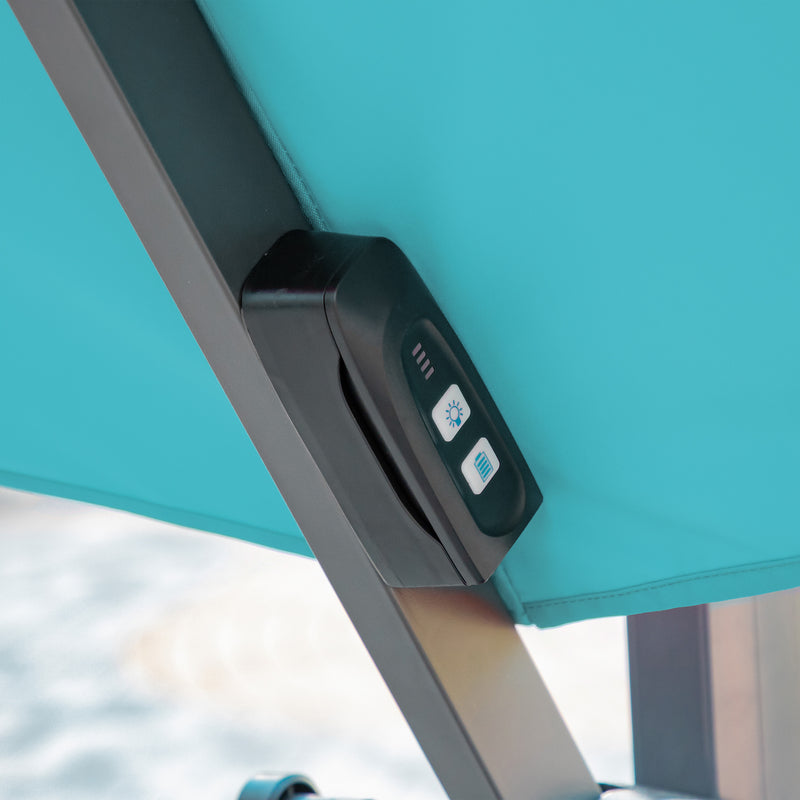 Close up of the control panel on a contemporary cantilever umbrella in teal fabric with solar LED lighting and carrying case