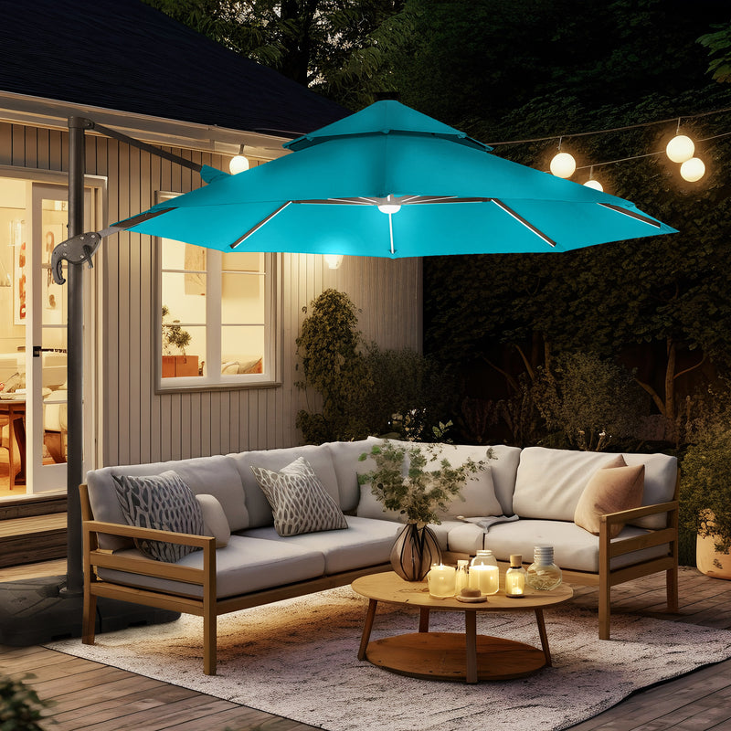 Right facing contemporary umbrella in teal fabric with solar LED lighting (base not included) at night on a patio with accessories