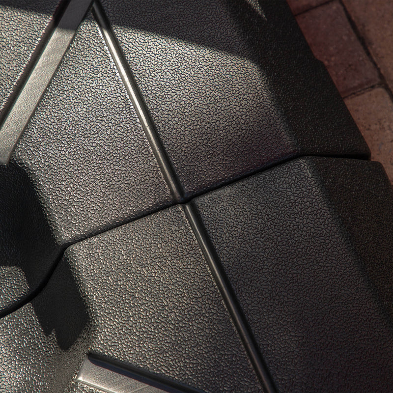 Close up of a contemporary high-density polyethylene fillable square umbrella base