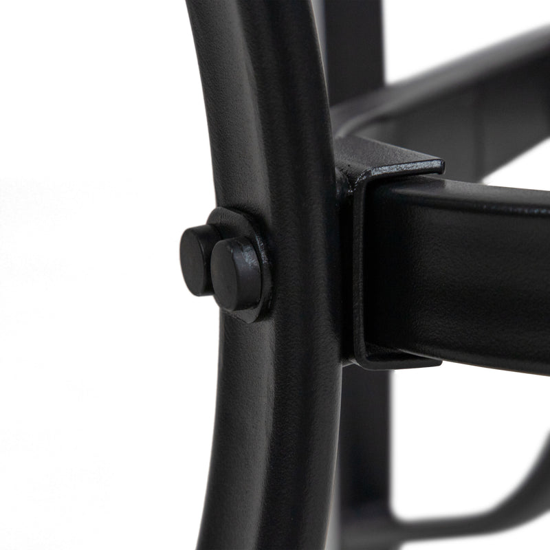 Close up of the leg and construction of a transitional black and textured glass patio outdoor dining table on a white background