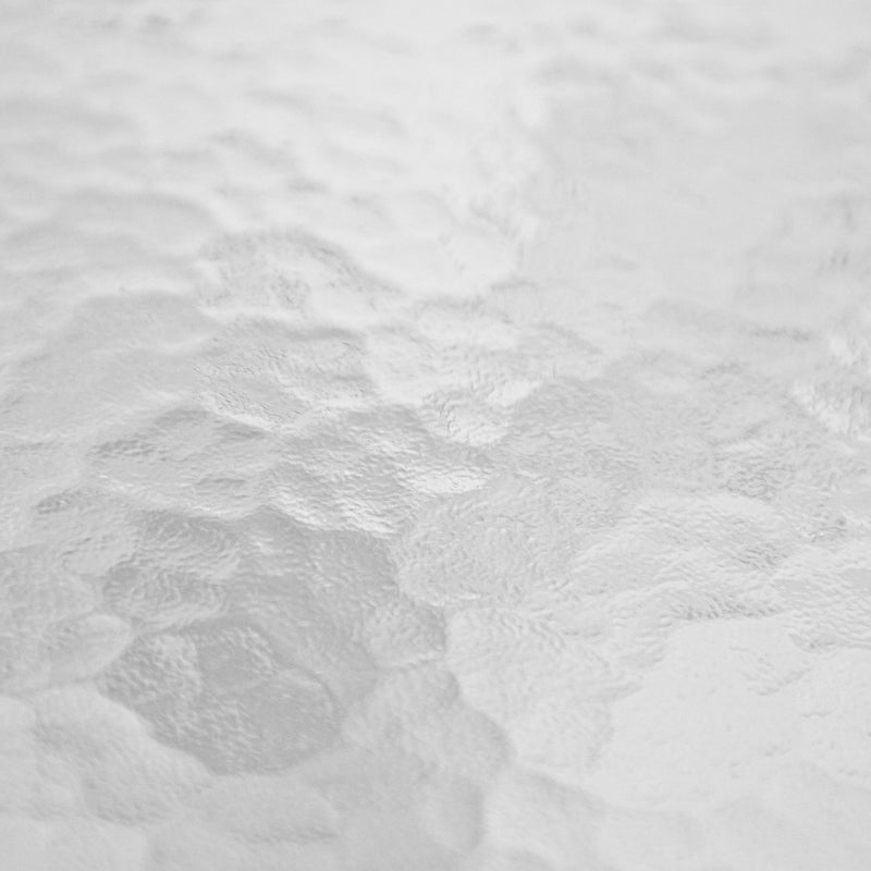 Swatch image of the water ripple glass tabletop of a transitional black and textured glass patio outdoor dining table