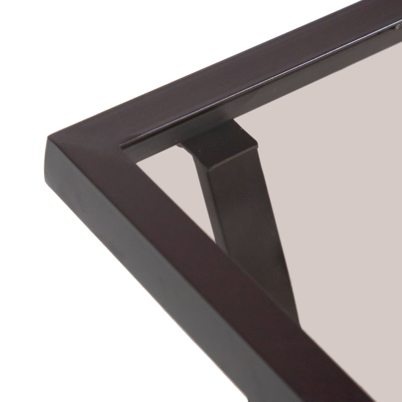 Close up of the tabletop corner of a four-piece transitional beige outdoor patio seating set with a table, two chairs, and a loveseat on a white background