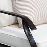 Close up of the armrest and cushions of a four-piece transitional beige outdoor patio seating set with a table, two chairs, and a loveseat