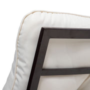 Close up of the backrest and cushion of a four-piece transitional beige outdoor patio seating set with a table, two chairs, and a loveseat on a white background
