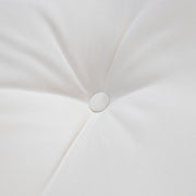 Close up of the tufted cushion of a four-piece transitional beige outdoor patio seating set with a table, two chairs, and a loveseat 